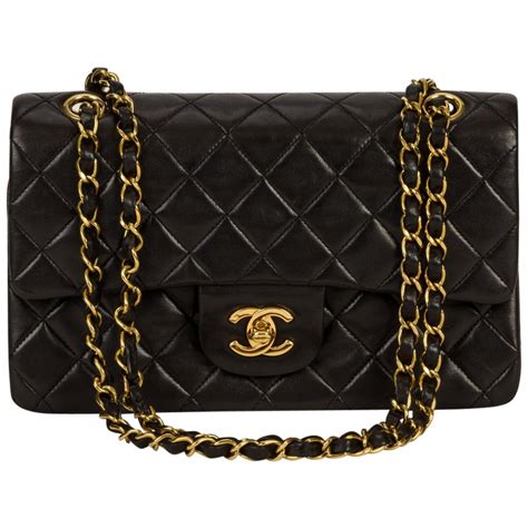 black bag with gold hardware chanel|Chanel black classic flap bag.